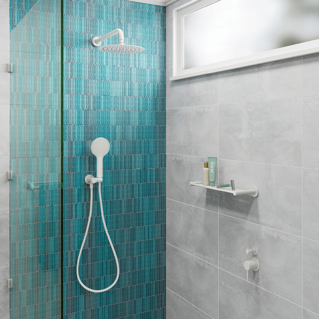 Modern bathroom with teal tiled shower area and gray walls.